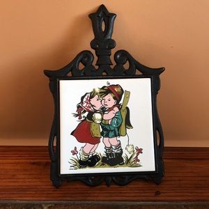 Vintage trim trivet with wrought iron frame